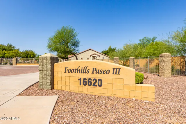 a view of a garden with a cars park