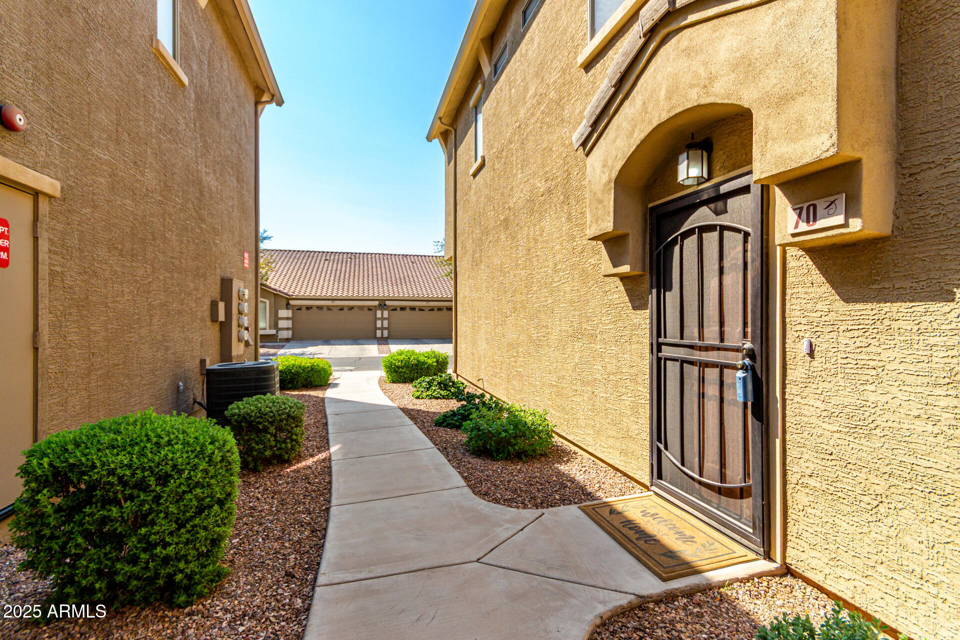 16620 South 48th Street, Unit 70 Phoenix, AZ 85048 - Photo 33 of 36 a view of a door with a potted plant