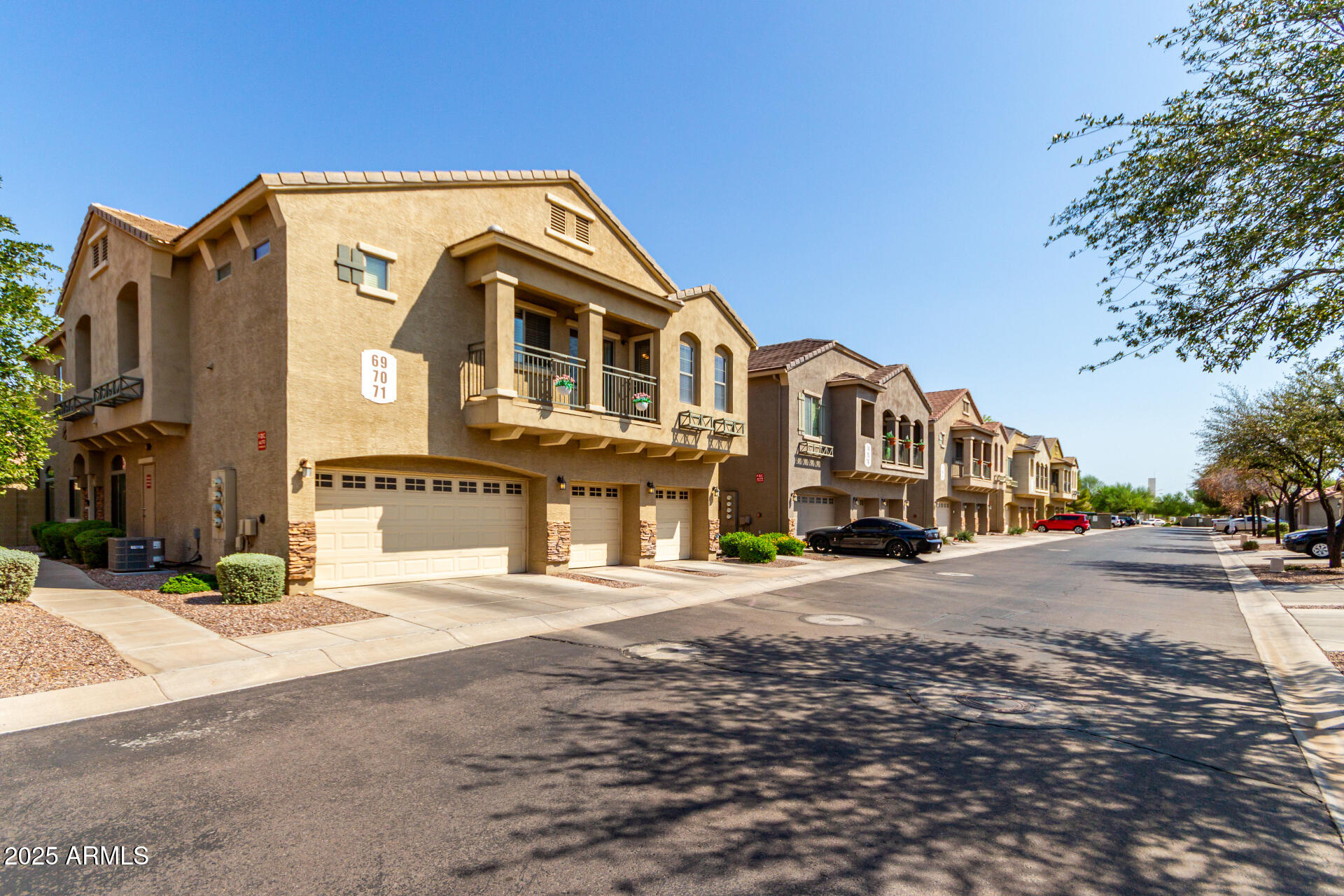 16620 South 48th Street, Unit 70 Phoenix, AZ 85048 - Photo 34 of 36 a front view of a house with a yard