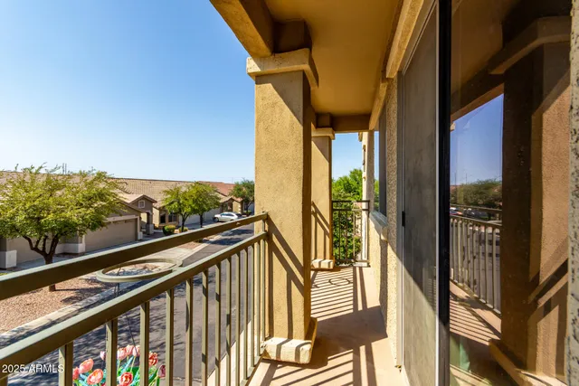 a view of balcony with furniture