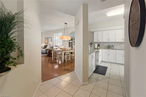 a view of kitchen with furniture and wooden floor