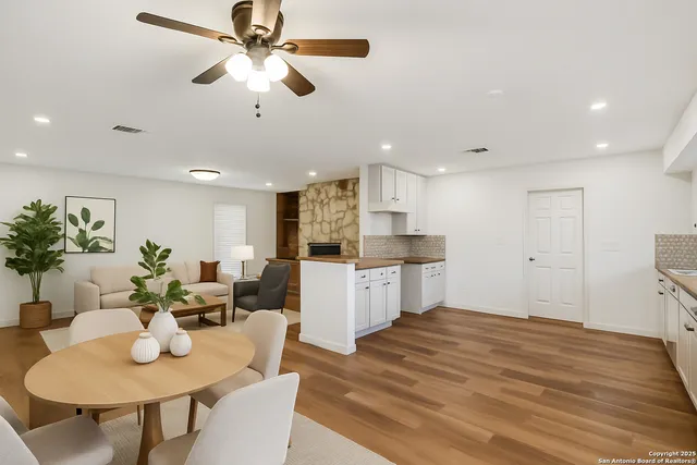 a kitchen with a table and chairs in it