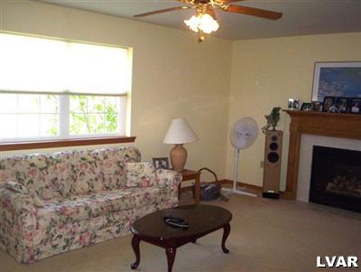145 Little Twig Road Effort, PA 18330 - Photo 5 of 8 a living room with furniture and a fireplace