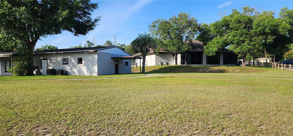 Tbd Southwest Viburnum Road Dunnellon, FL 34431 - Photo 18 of 25 a front view of house with yard and trees in the background