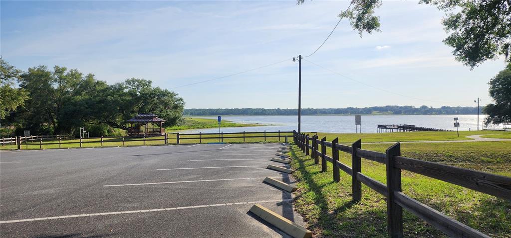 Tbd Southwest Viburnum Road Dunnellon, FL 34431 - Photo 21 of 25 a view of a swimming pool with a lawn chairs