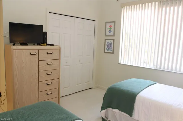 a bedroom with a bed and a table