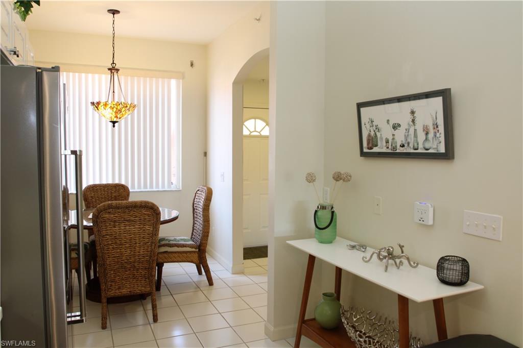 6660 Beach Resort Drive, Unit 1005 Naples, FL 34114 - Photo 29 of 38 a view of a hallway with furniture and windows
