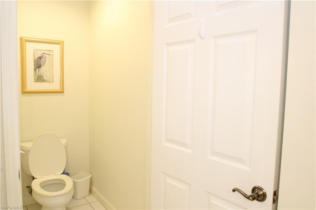 6660 Beach Resort Drive, Unit 1005 Naples, FL 34114 - Photo 5 of 38 a bathroom with a toilet and a shower