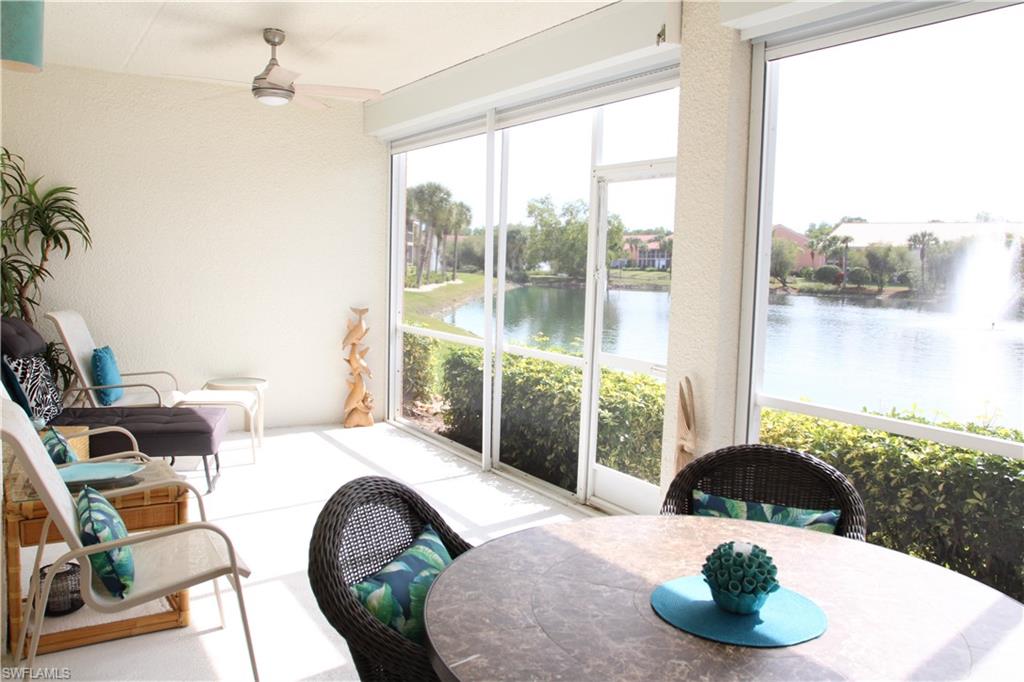 6660 Beach Resort Drive, Unit 1005 Naples, FL 34114 - Photo 7 of 38 a bedroom with a bed and a large window