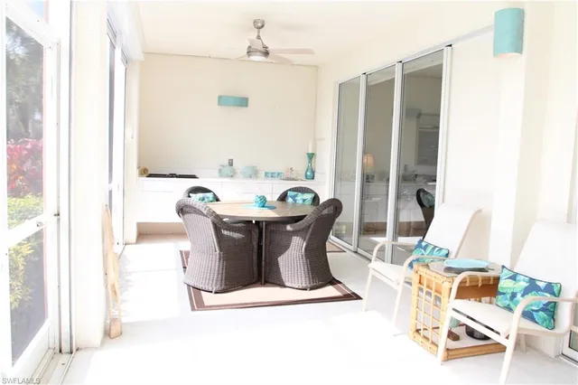 a view of a dining room with furniture window and outside view