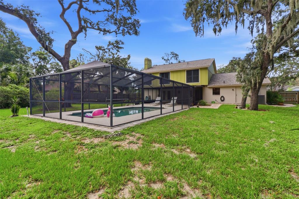 302 Bloomingfield Drive Brandon, FL 33511 - Photo 54 of 58 a view of an house with backyard and a tree