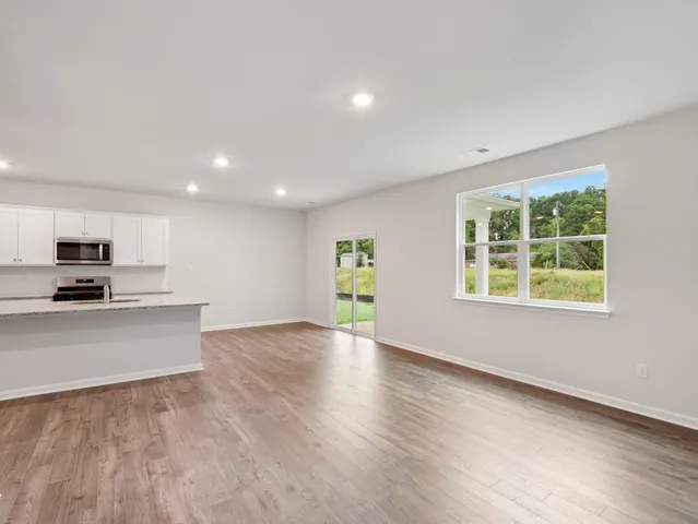 a view of a kitchen with a sink and a stove top oven