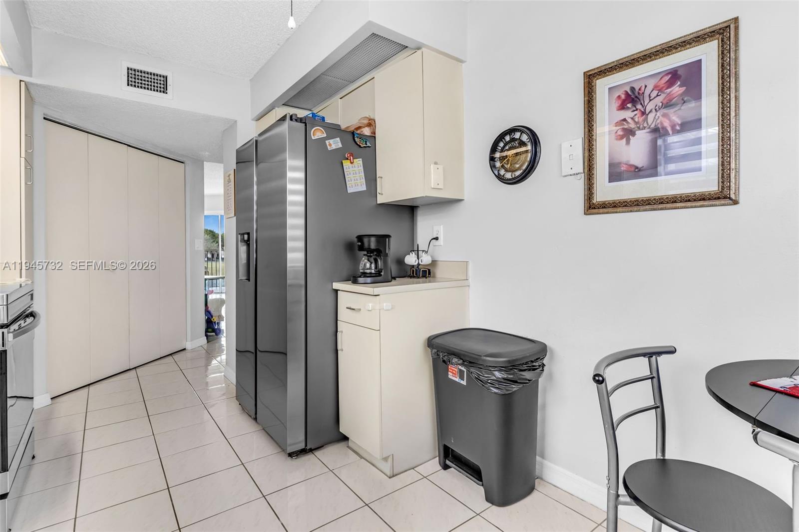 2520 Southeast 20th Place, Unit 204B Homestead, FL 33035 - Photo 11 of 45 a kitchen with stainless steel appliances granite countertop a refrigerator a stove and a sink