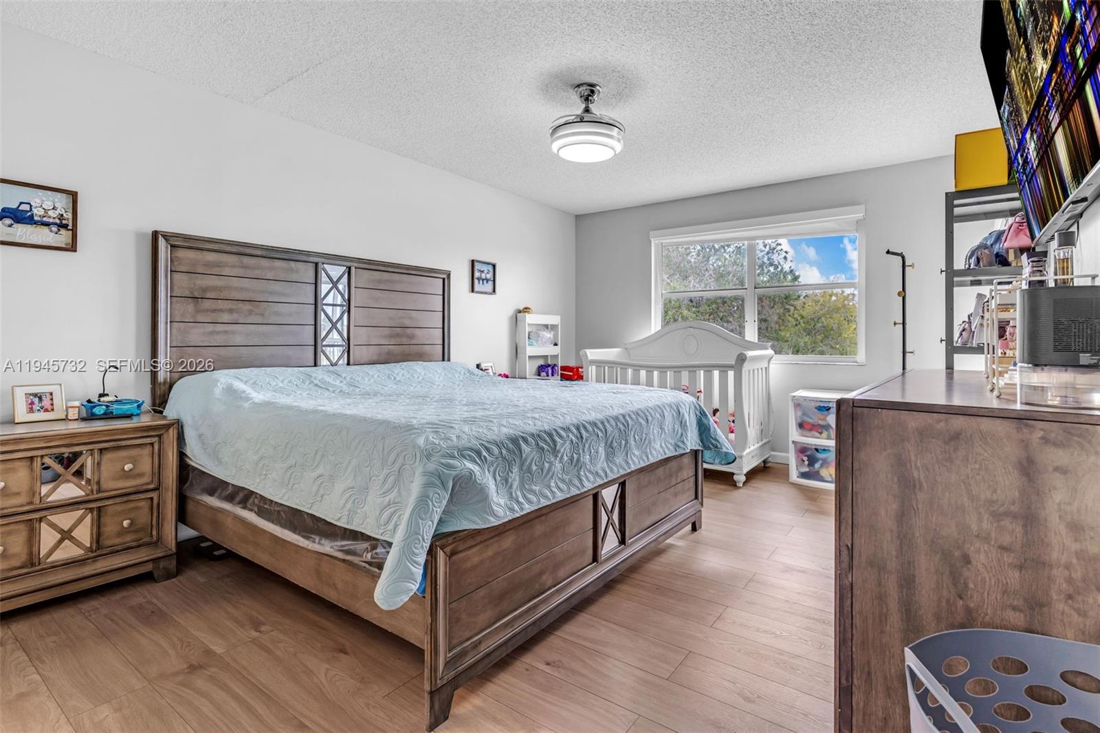 2520 Southeast 20th Place, Unit 204B Homestead, FL 33035 - Photo 12 of 45 a bedroom with a bed next to a window with the outer view