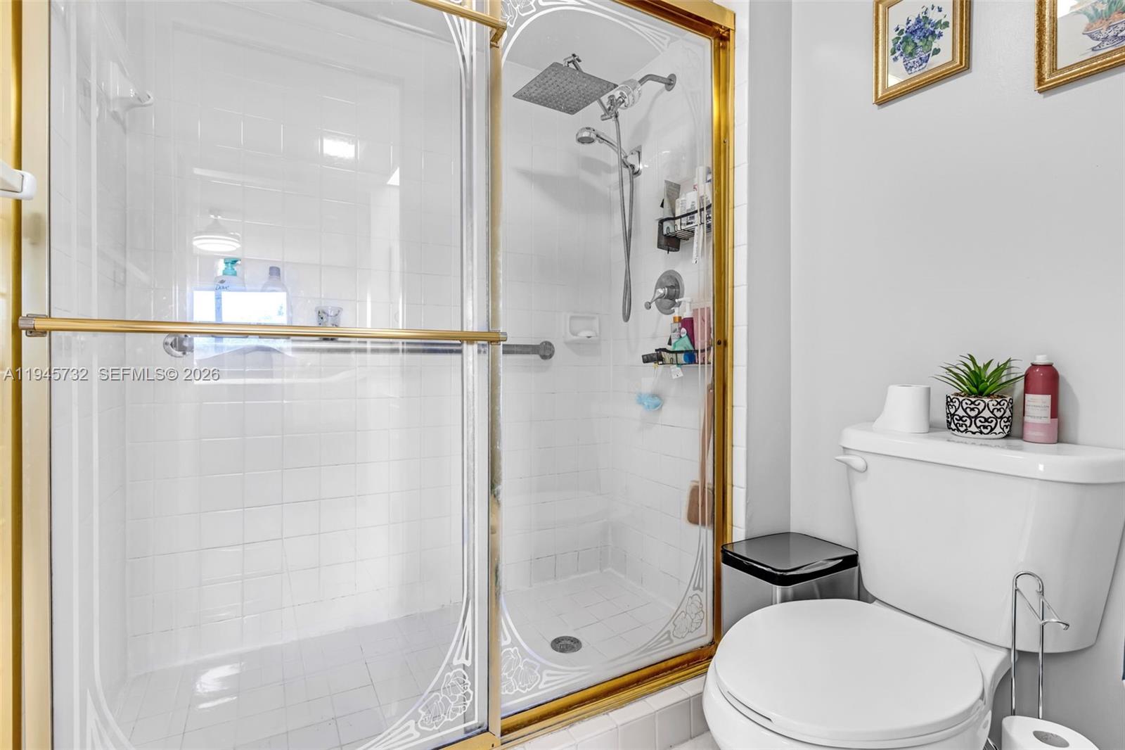 2520 Southeast 20th Place, Unit 204B Homestead, FL 33035 - Photo 15 of 45 a bathroom with a shower a toilet and a sink