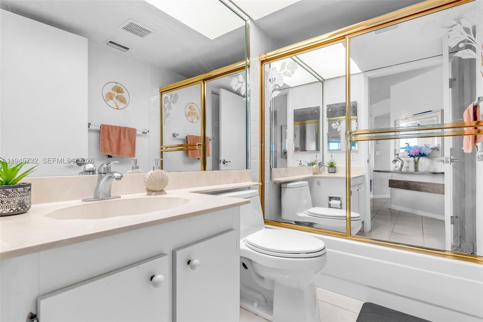 2520 Southeast 20th Place, Unit 204B Homestead, FL 33035 - Photo 20 of 45 a bathroom with a granite countertop sink mirror vanity and toilet