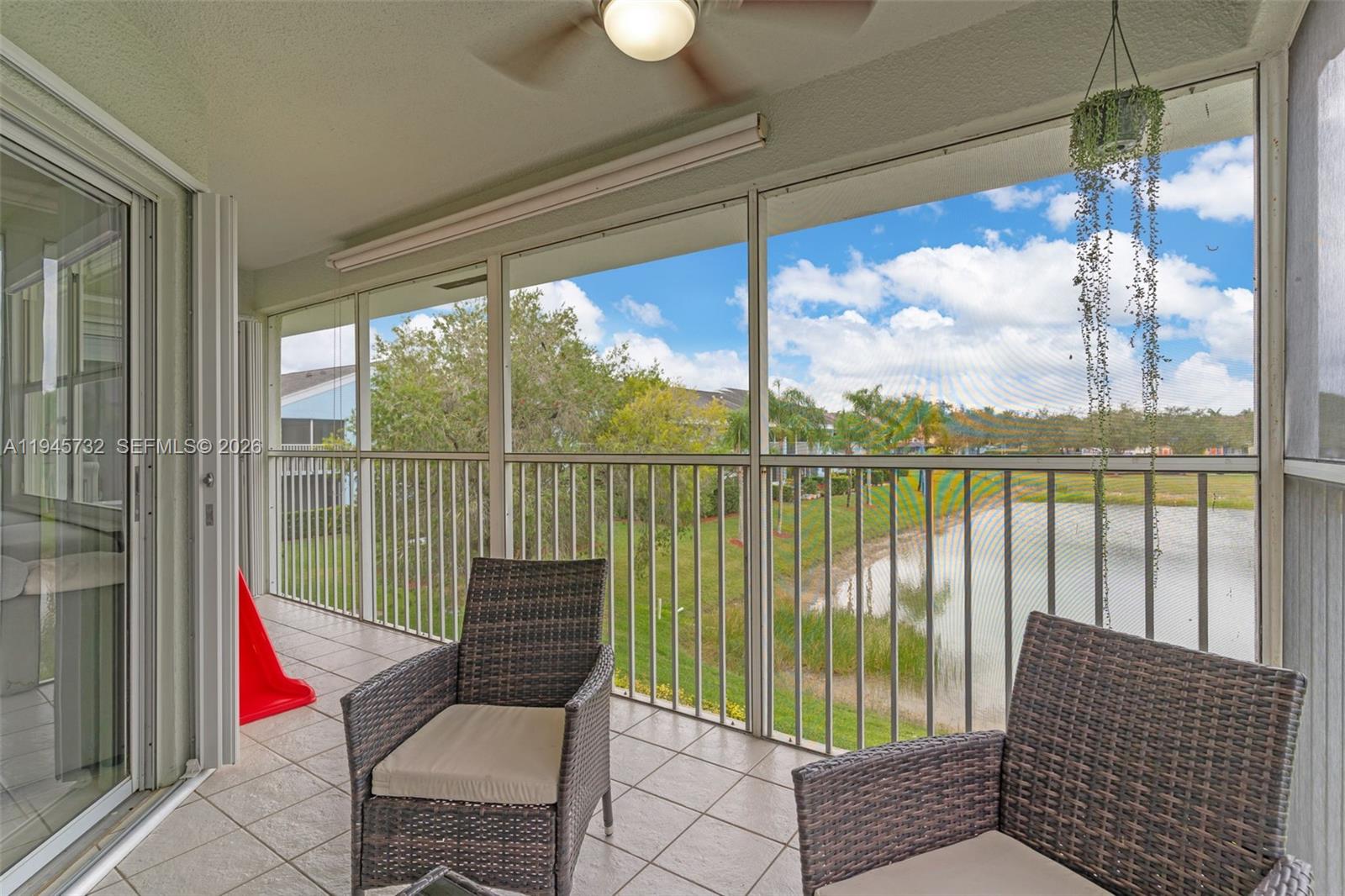 2520 Southeast 20th Place, Unit 204B Homestead, FL 33035 - Photo 24 of 45 a view of a chair and tables in the balcony