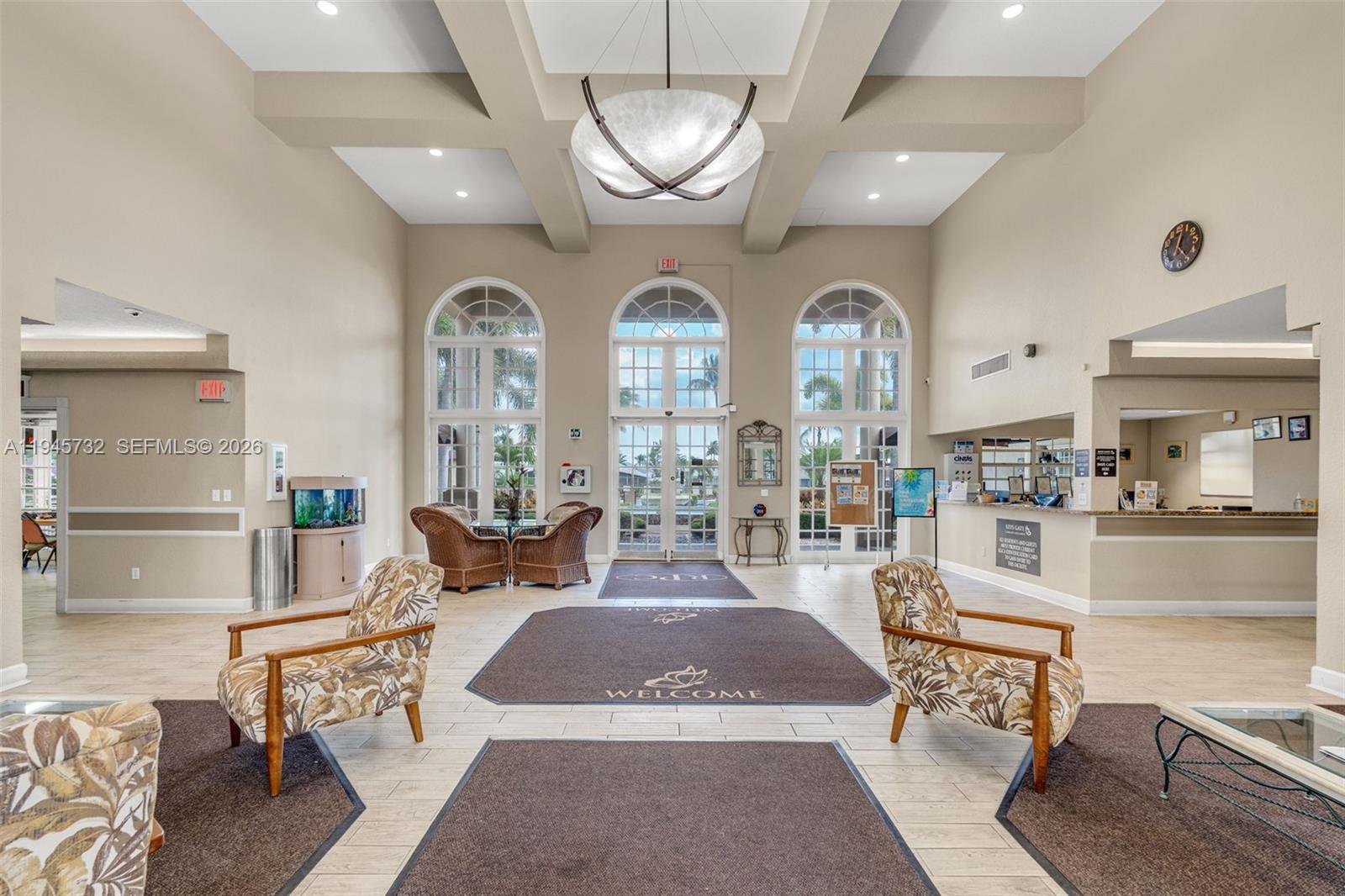 2520 Southeast 20th Place, Unit 204B Homestead, FL 33035 - Photo 31 of 45 a living room with furniture and a chandelier