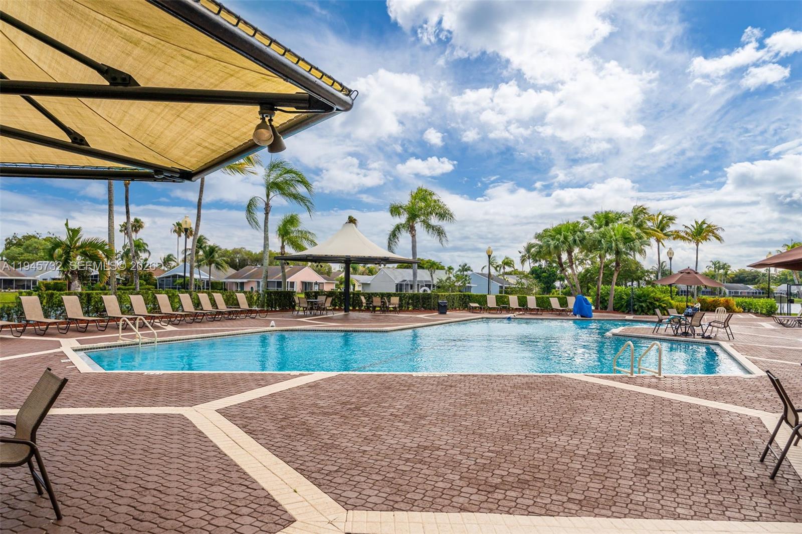 2520 Southeast 20th Place, Unit 204B Homestead, FL 33035 - Photo 33 of 45 a view of a swimming pool with a patio