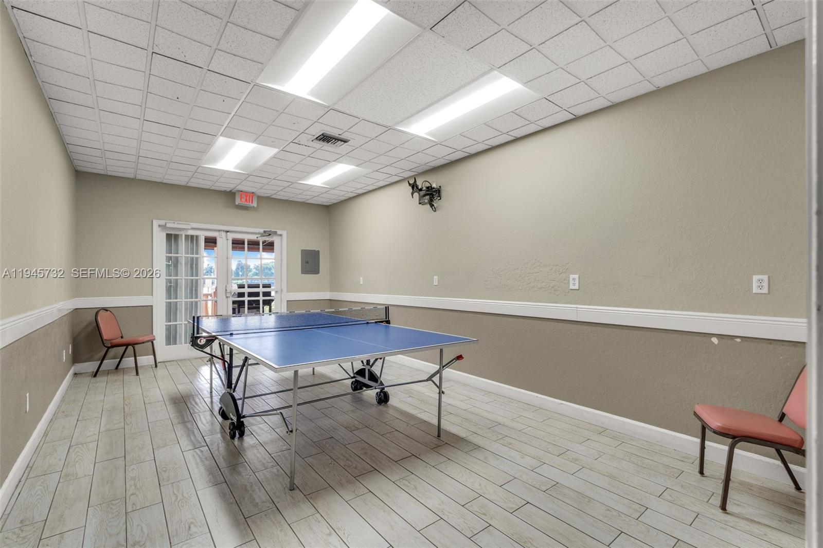 2520 Southeast 20th Place, Unit 204B Homestead, FL 33035 - Photo 37 of 45 a room with furniture and wooden floor