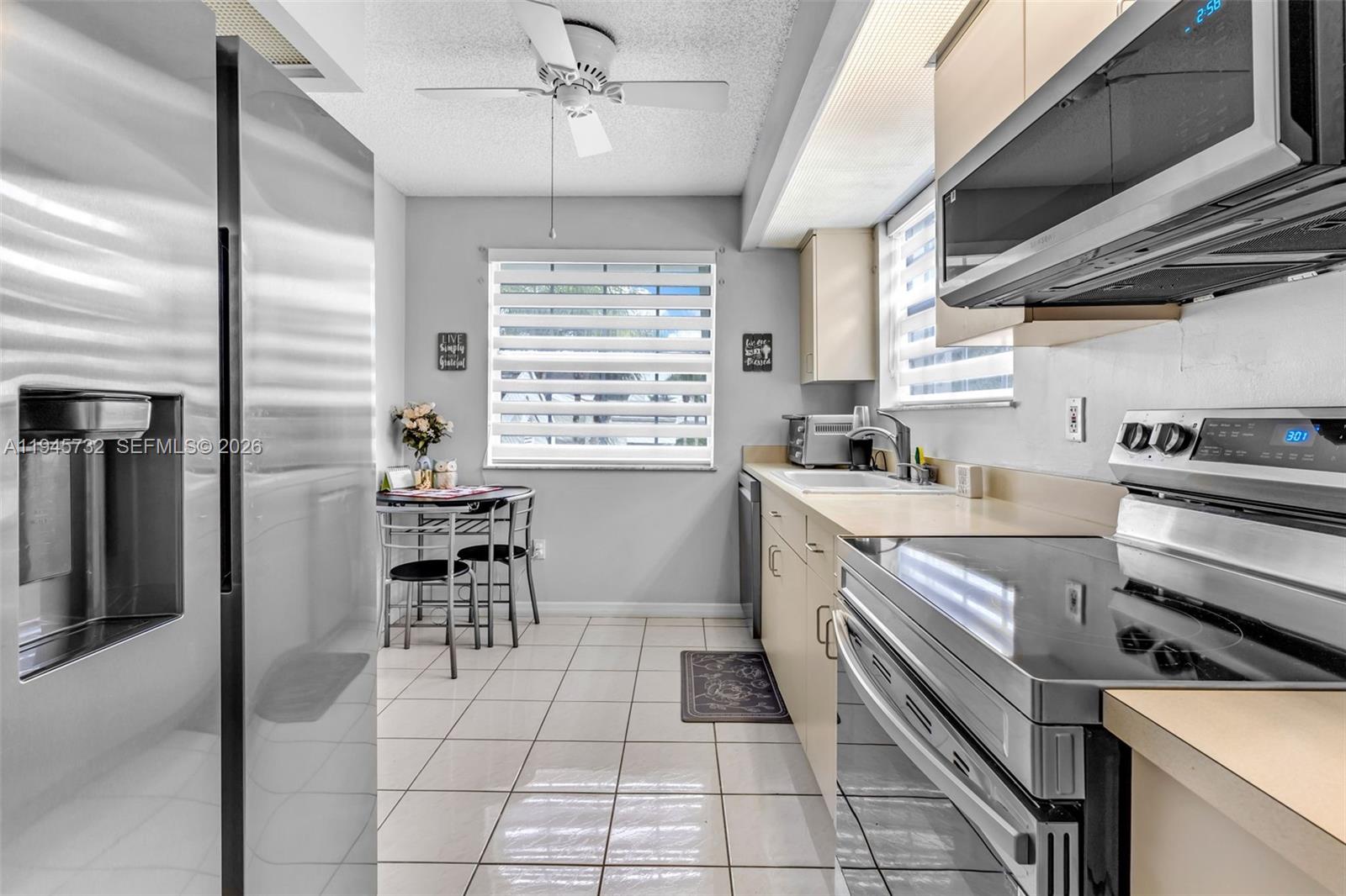 2520 Southeast 20th Place, Unit 204B Homestead, FL 33035 - Photo 9 of 45 a kitchen with a stove cabinets and counter space
