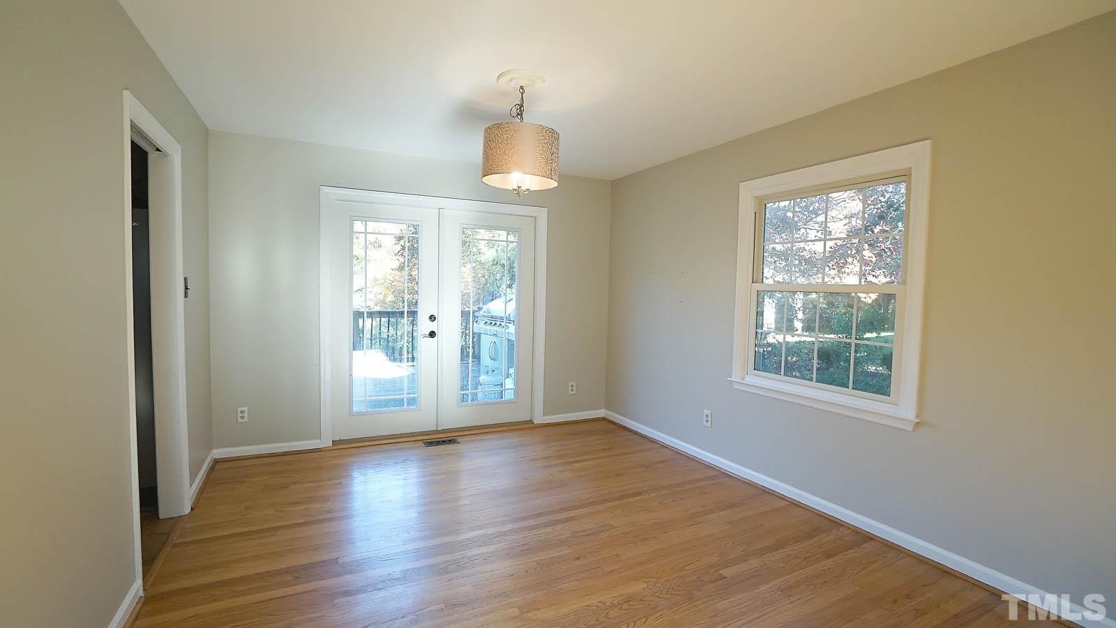 406 Snelling Road Raleigh, NC 27609 - Photo 11 of 22 Large dining room overlooking backyard