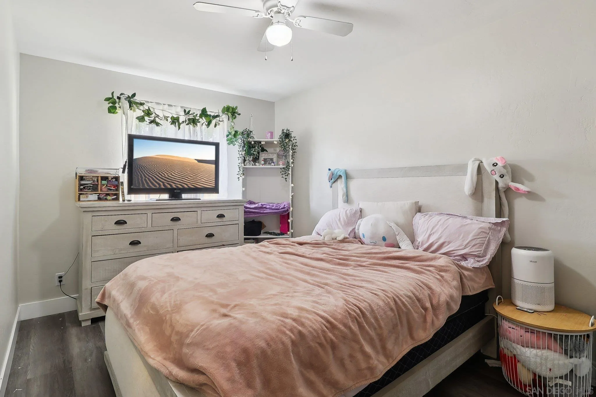 1673 Walbollen Street Spring Valley, CA 91977 - Photo 12 of 21 a bedroom with a bed and a flat screen tv
