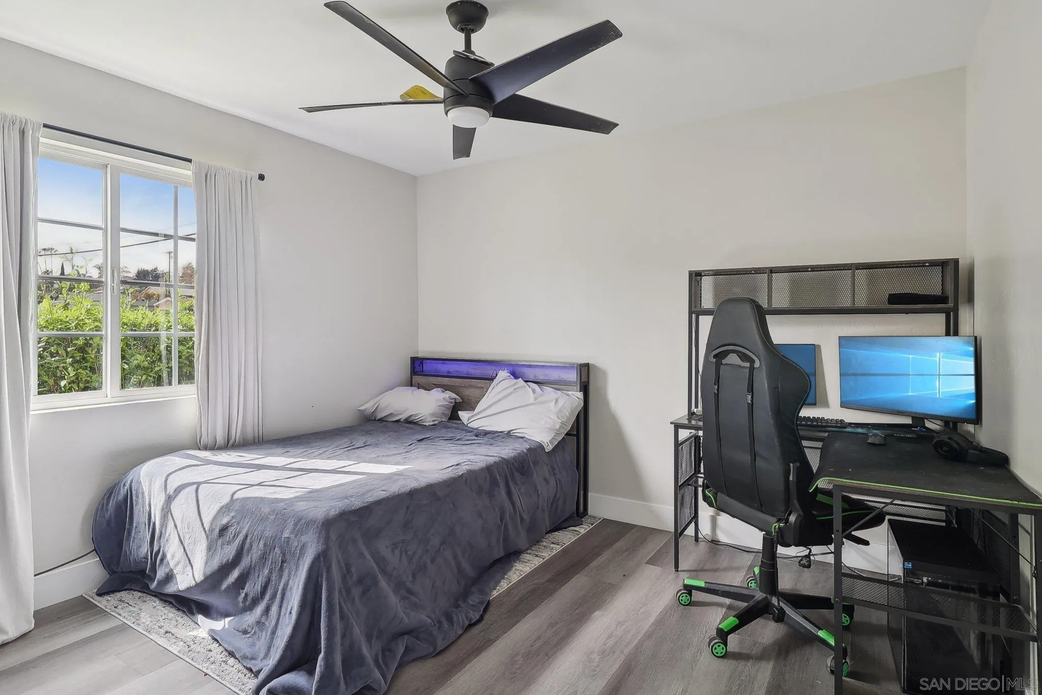 1673 Walbollen Street Spring Valley, CA 91977 - Photo 14 of 21 a bedroom with a bed and a desk