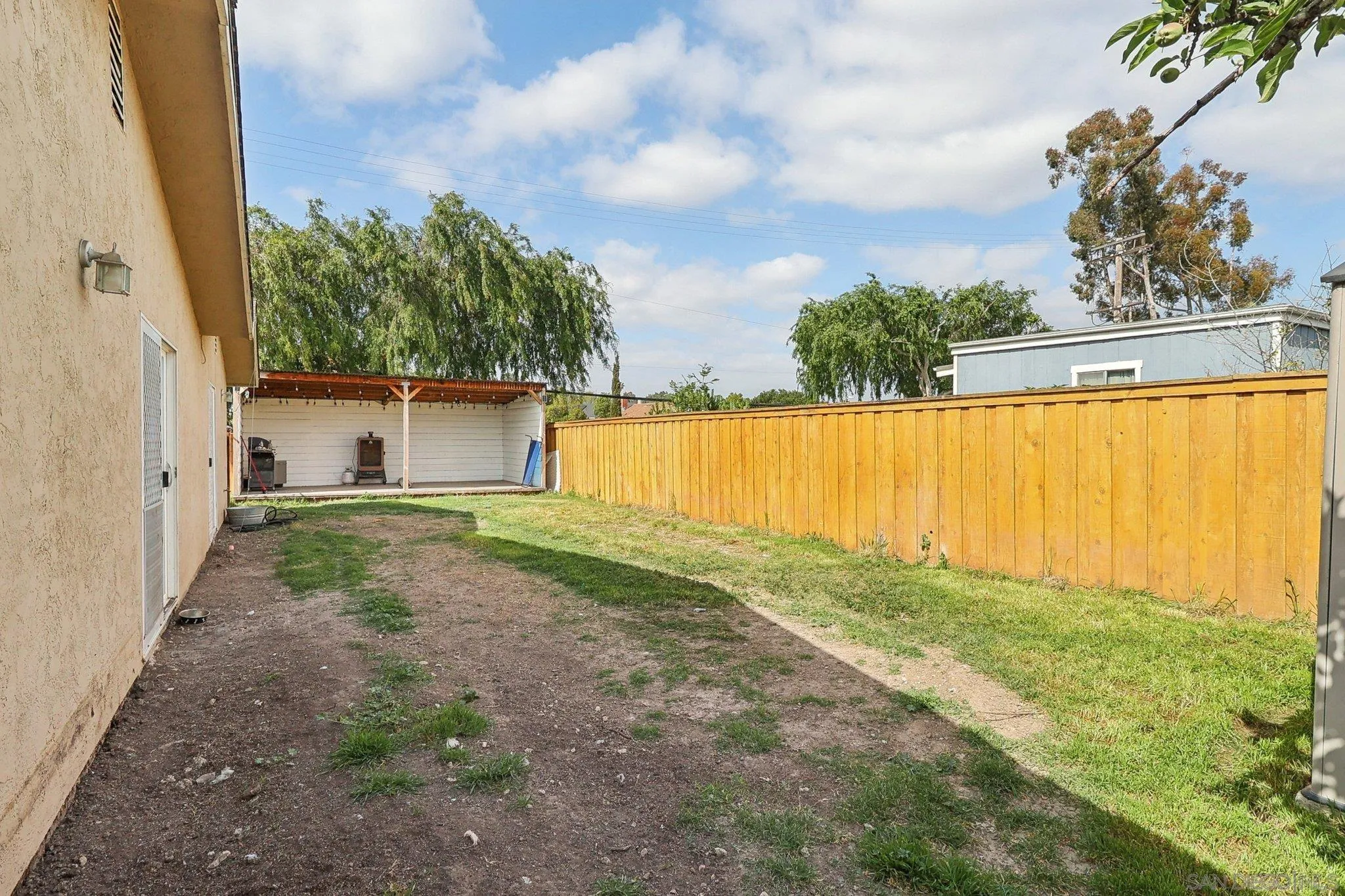 1673 Walbollen Street Spring Valley, CA 91977 - Photo 16 of 21 a view of a backyard with plants and a lake view