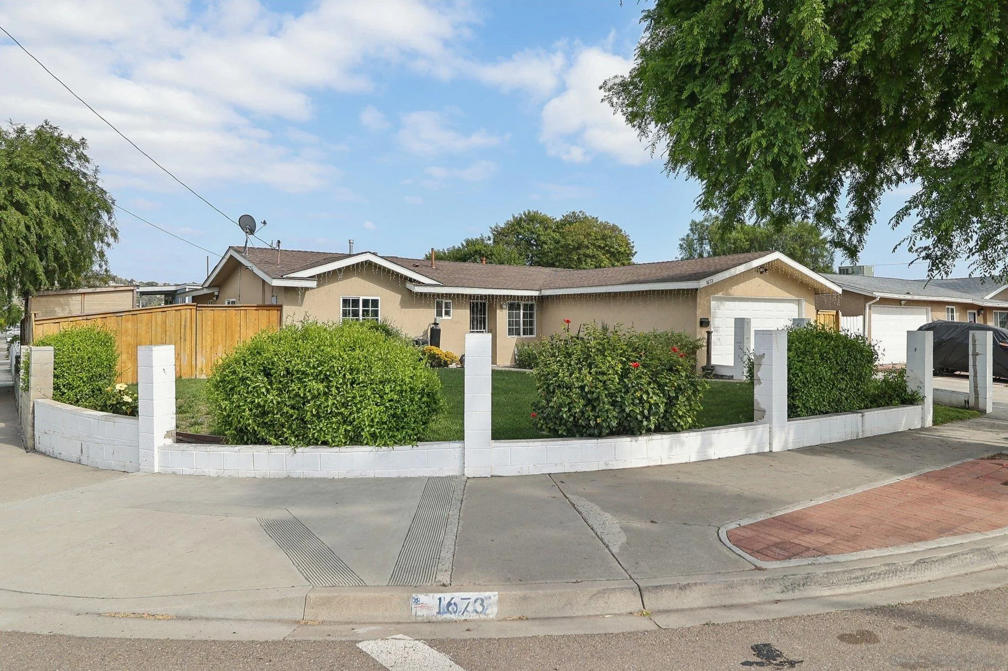 1673 Walbollen Street Spring Valley, CA 91977 - Photo 19 of 21 front view of a house next to a yard