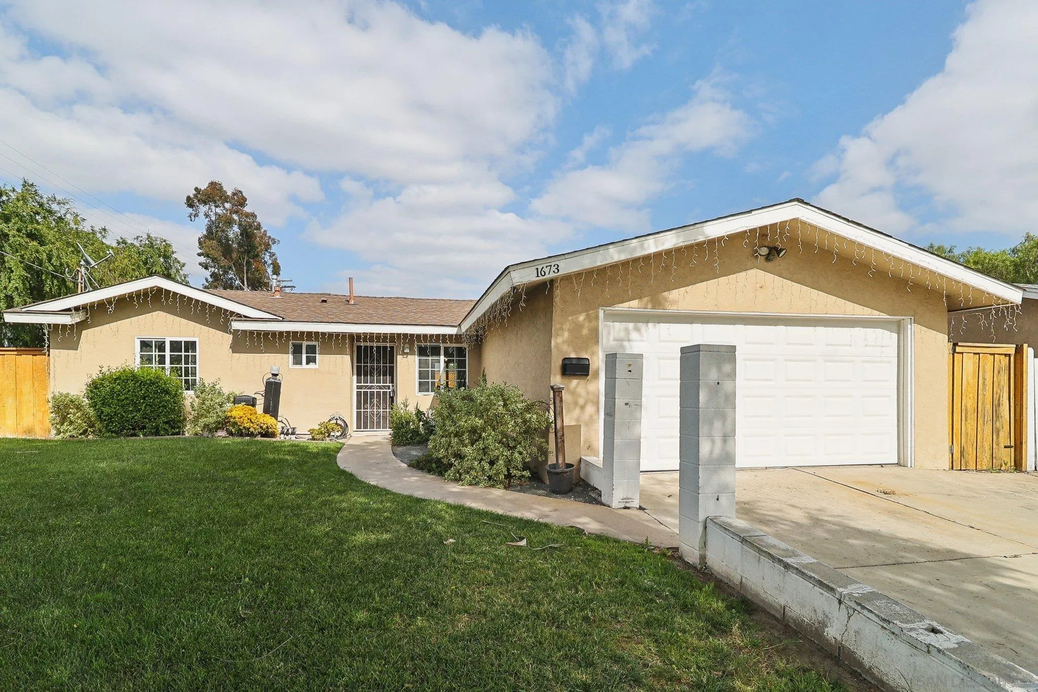 1673 Walbollen Street Spring Valley, CA 91977 - Photo 20 of 21 a front view of a house with a yard