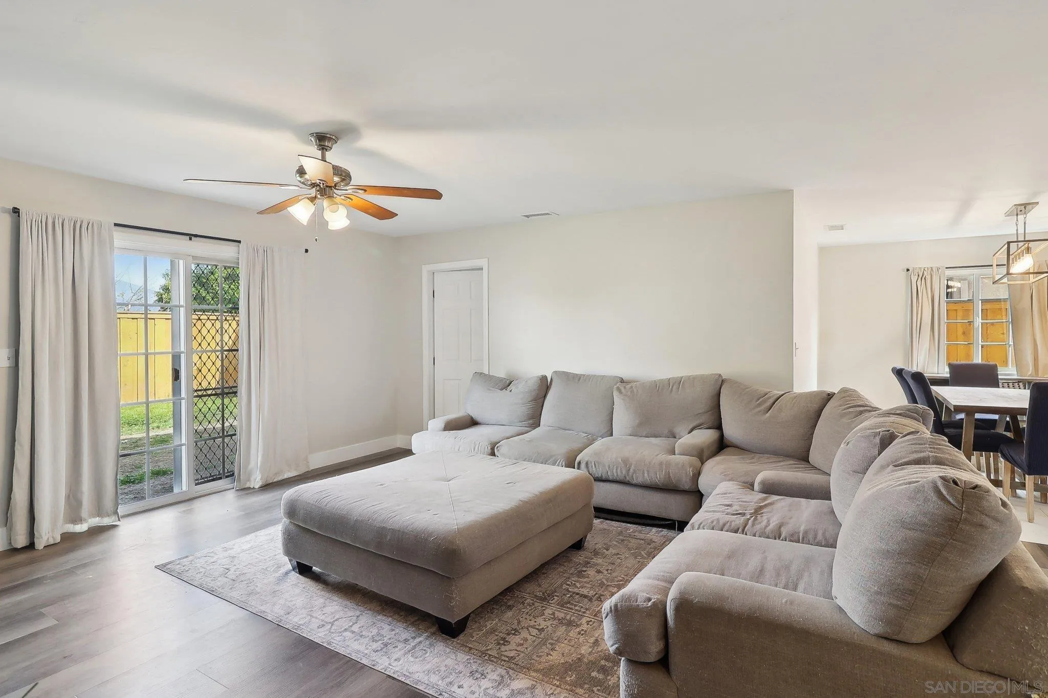 1673 Walbollen Street Spring Valley, CA 91977 - Photo 4 of 21 a living room with furniture and wooden floor