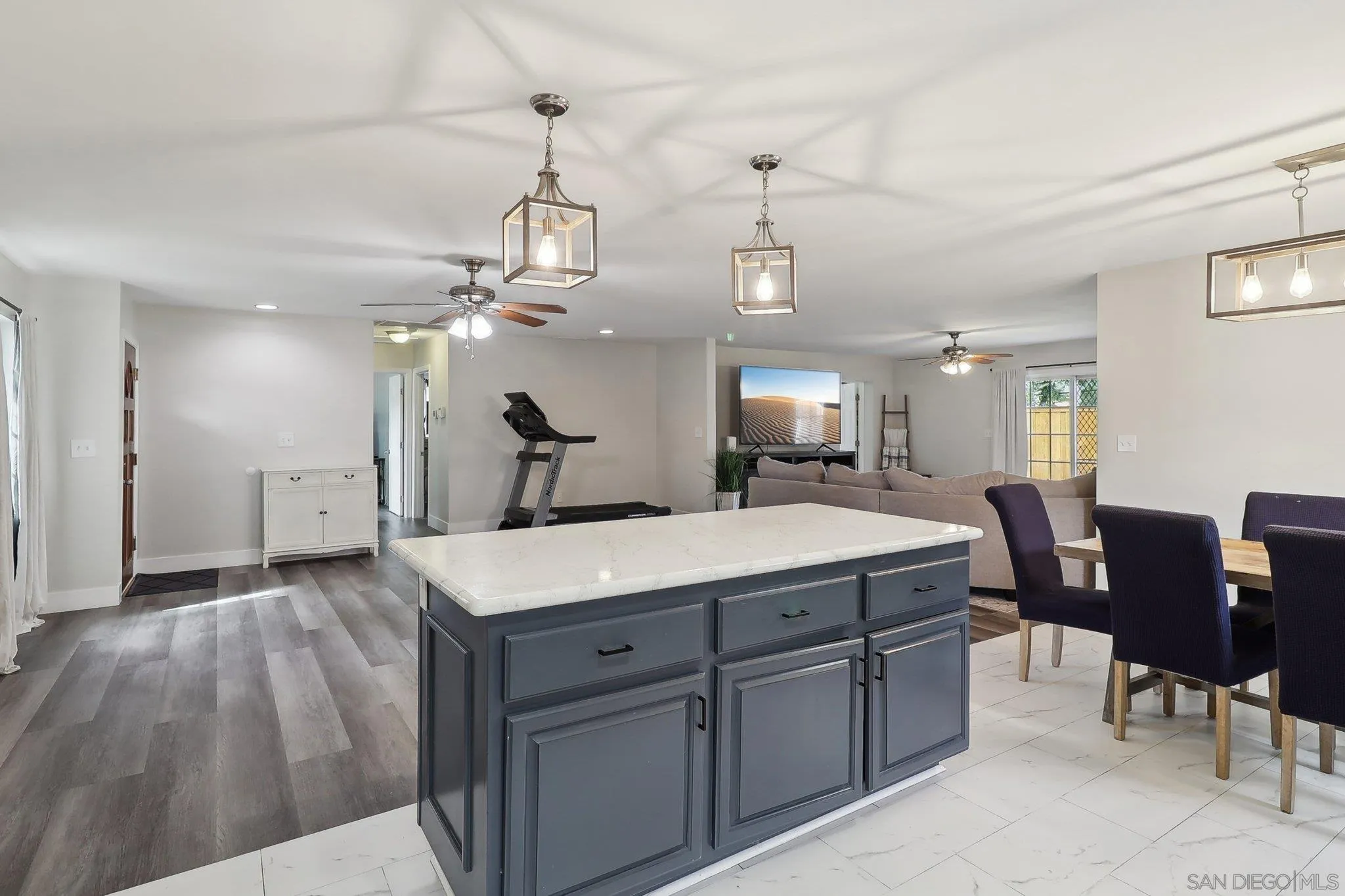 1673 Walbollen Street Spring Valley, CA 91977 - Photo 7 of 21 a large kitchen with kitchen island a chandelier and living room