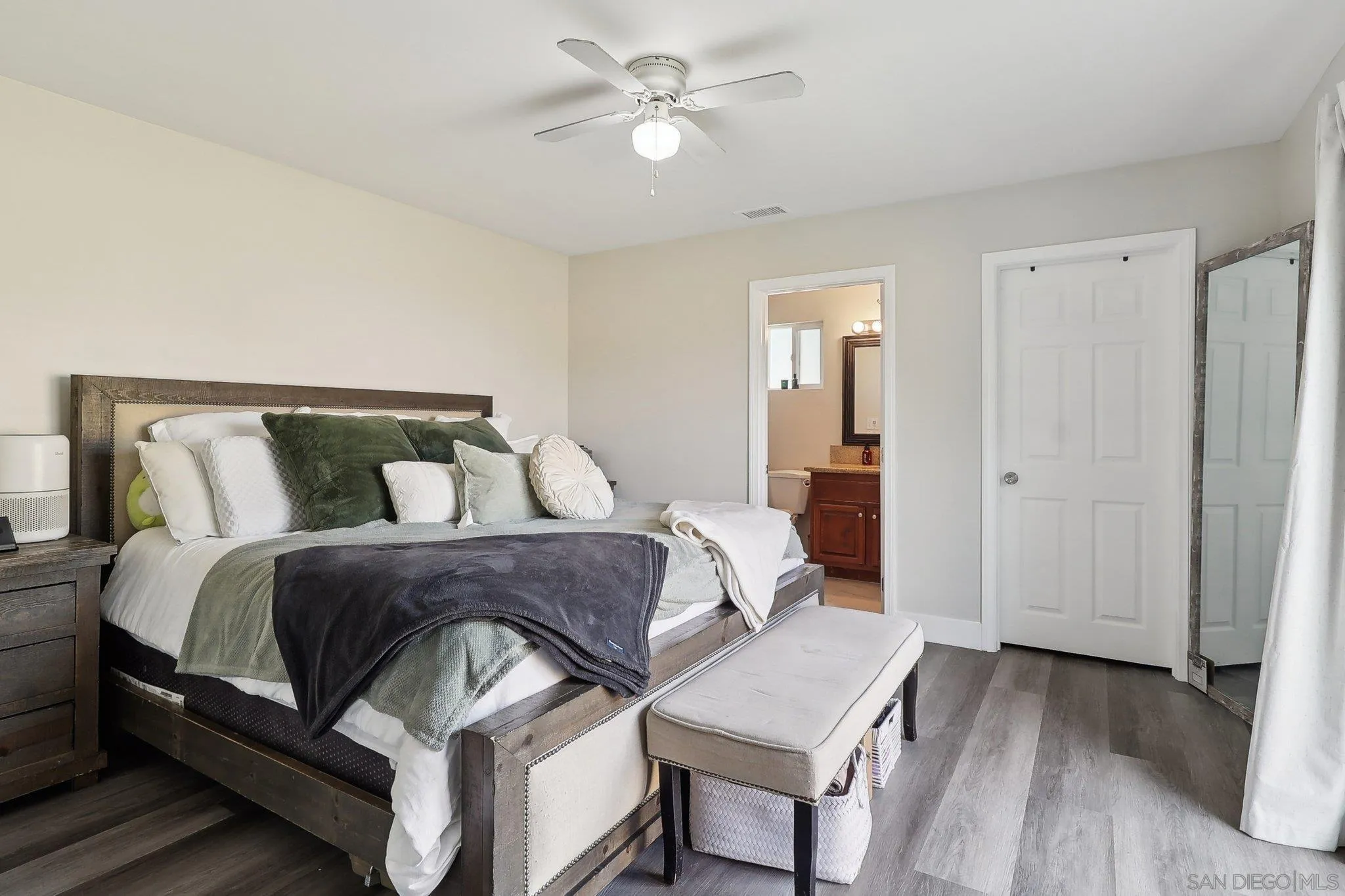 1673 Walbollen Street Spring Valley, CA 91977 - Photo 9 of 21 a bedroom with bed and wooden floor