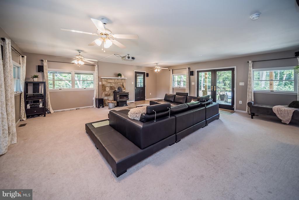 12550 Rousby Hall Road Lusby, MD 20657 - Photo 5 of 30 Wood burning stove, projector & built in sound