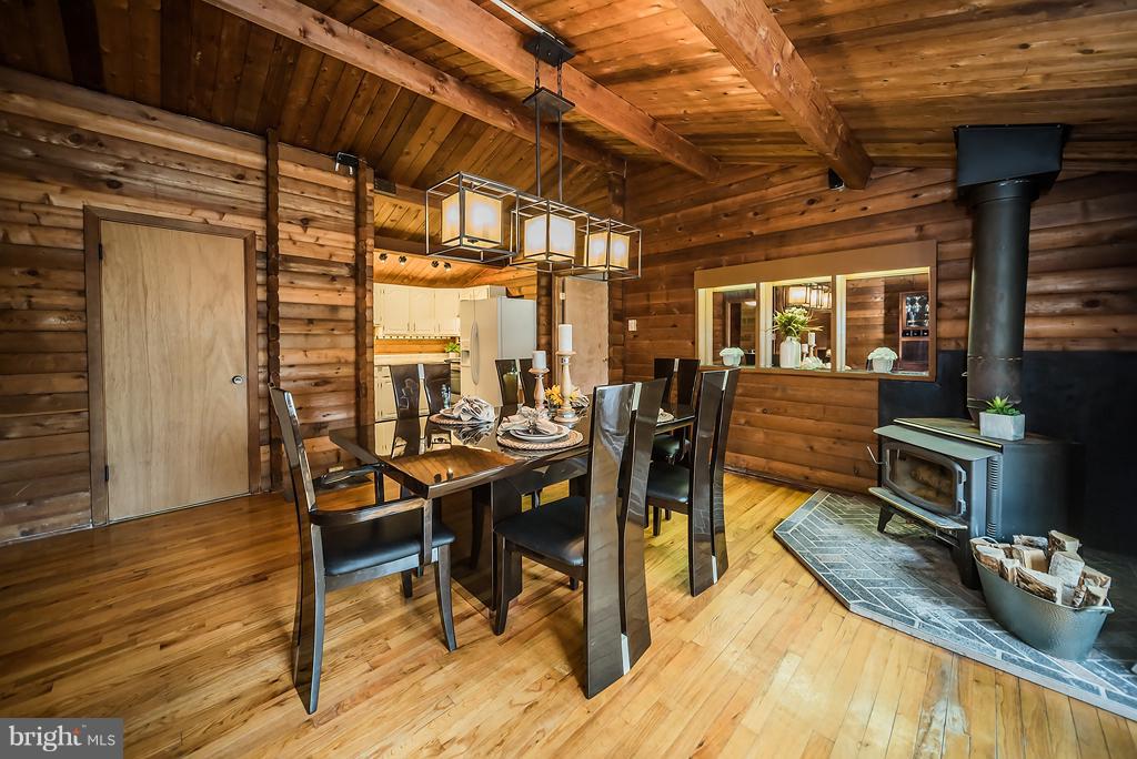12550 Rousby Hall Road Lusby, MD 20657 - Photo 10 of 30 Dining Room view 2 and 2nd wood burning stove