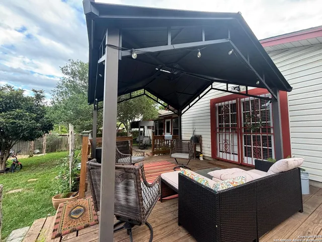 a outdoor living space with patio furniture and garden