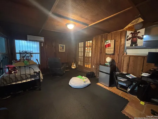a bed room with furniture and a chair