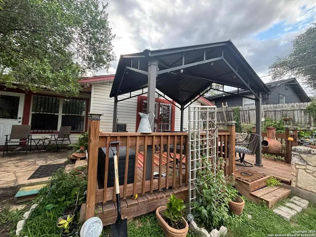 a view of a chairs and table in the patio