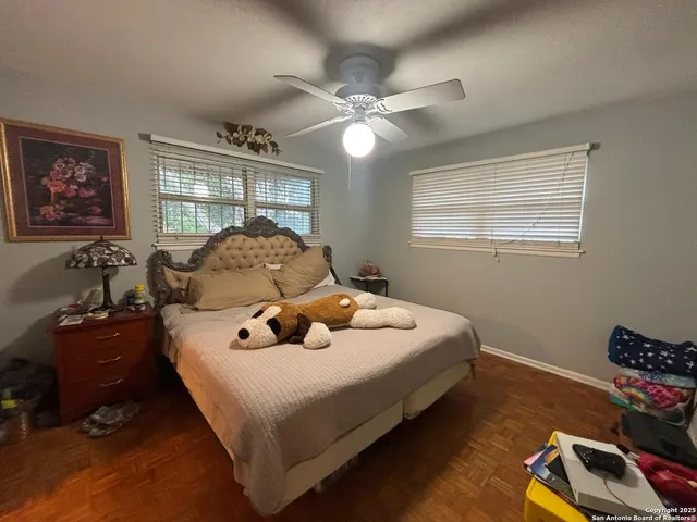 a bed room with bed and window