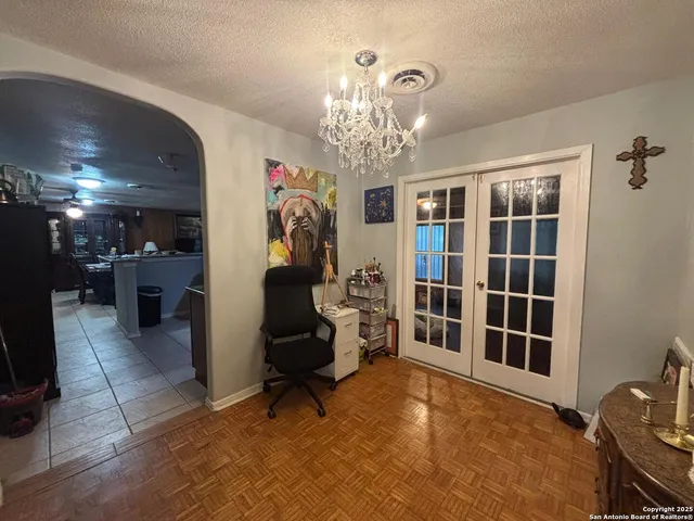 a view of a livingroom with furniture and a chandelier