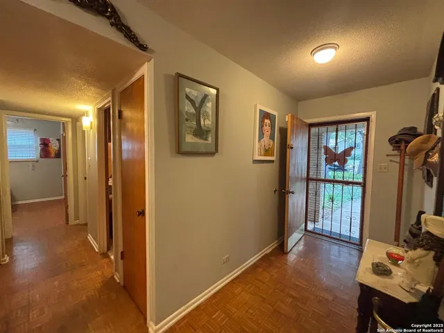 a view of a livingroom with furniture and hardwood floor
