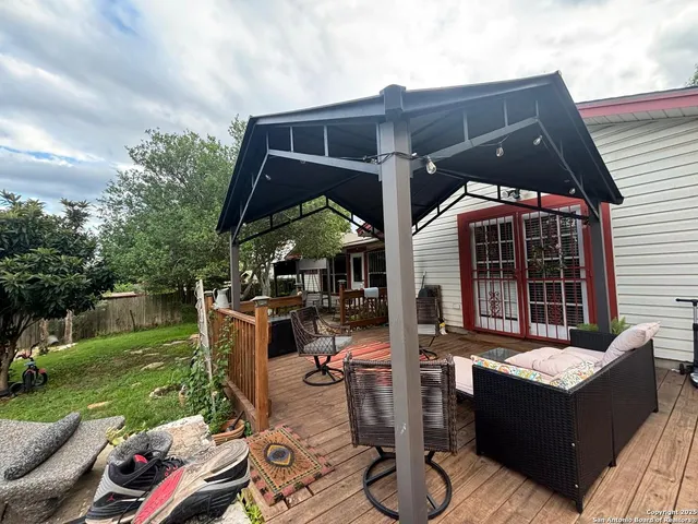 a front view of house with outdoor seating yard and green space