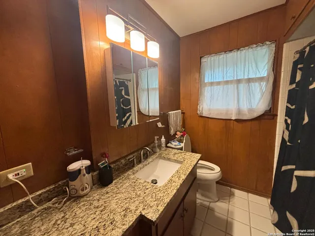 a house view with a sitting space and garden