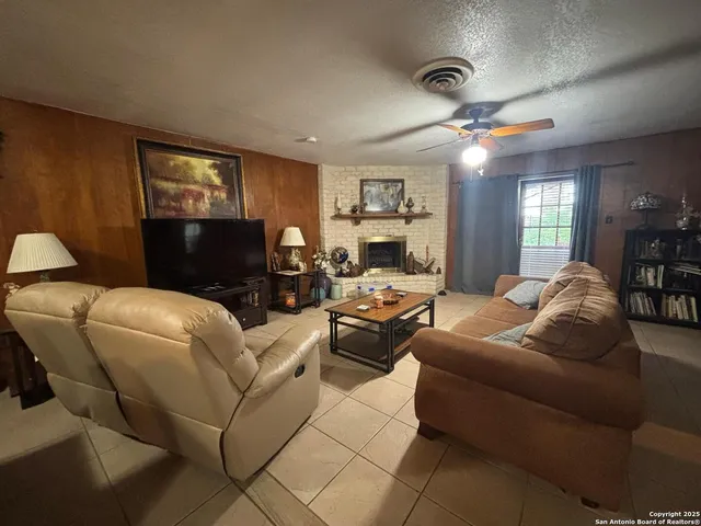 a kitchen with a sink a stove and cabinets