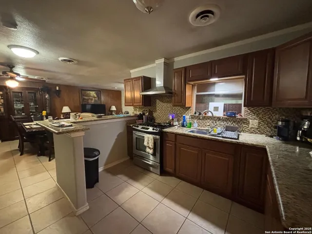 a view of yard with green space and seating area