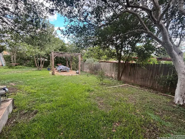 a view of a backyard with a slide
