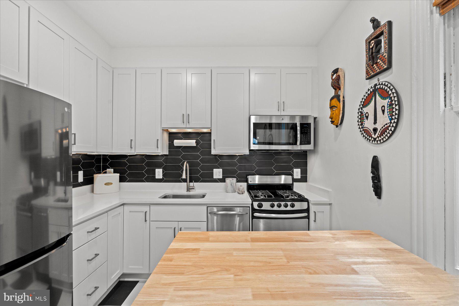 3022 R Street Northwest, Unit 1/2 Washington, DC 20007 - Photo 10 of 25 Recently updated kitchen