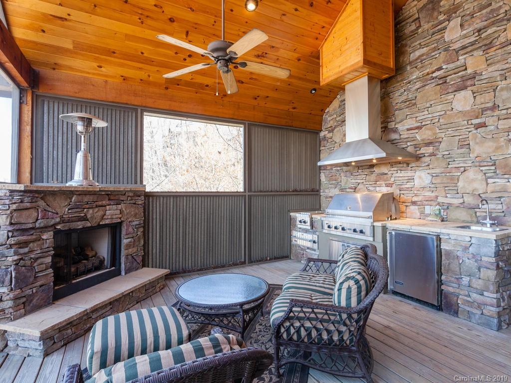 755 Andrew Banks Road Burnsville, NC 28714 - Photo 11 of 24 a view of a livingroom with furniture and a fireplace