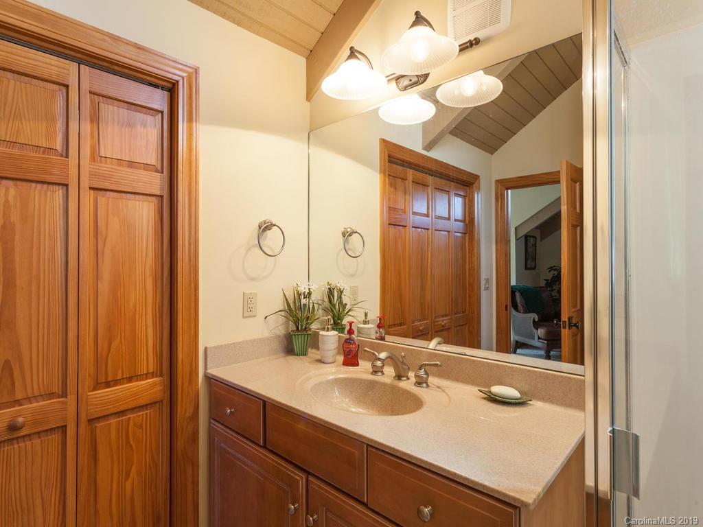 755 Andrew Banks Road Burnsville, NC 28714 - Photo 20 of 24 a bathroom with a sink vanity and a mirror